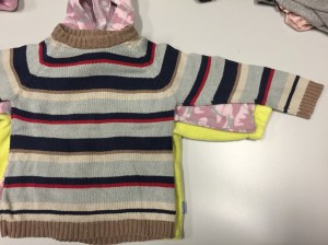 Notice the vastly different arm lengths for these same size sweaters.