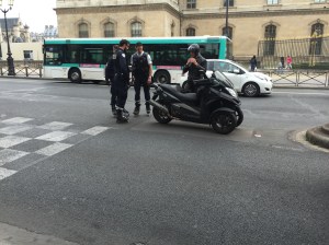 I'm going to guess "annoyed" (this guess is based on what the police officers from this photo are doing - issuing a parking ticket while wearing rollerblades) 